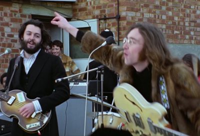 John Lennon pointing on Apple rooftop